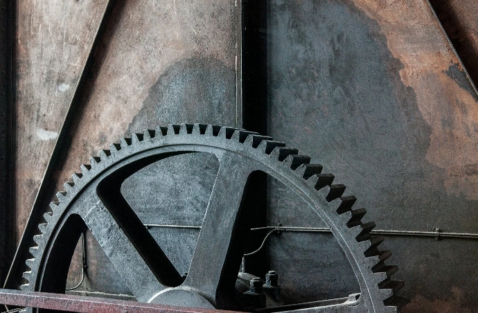a close up of a large metal gear wheel